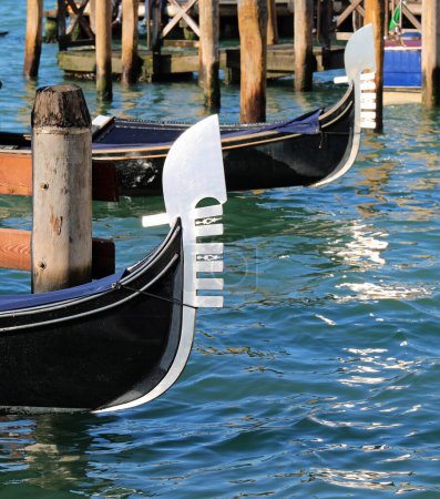 characteristic metal prows of traditional Venetian boats called GONDOLAS for the transport of tourists