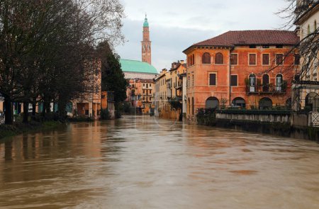 River called RETRONE in Vicenza City during flood and the monument Basilica Palladina in background