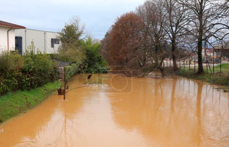 Photo for Small River flooding caused by climate change - Royalty Free Image