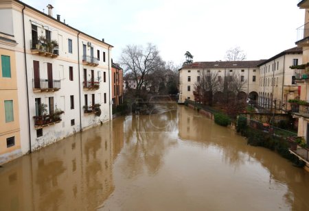 Photo for Vicenza, VI, Italy - February 28, 2024:  Retrone river during flood and houses - Royalty Free Image