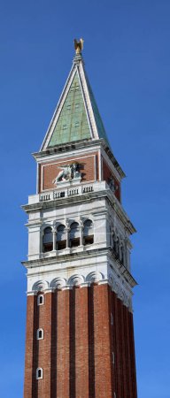 Venice, VE, Italy - February 13, 2024: Bell tower of Saint Mark called Campanile di San Marco in italian language and blue sky