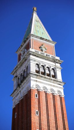 Venice, VE, Italy - February 13, 2024: Famous Bell tower of Venice and blue sky in background