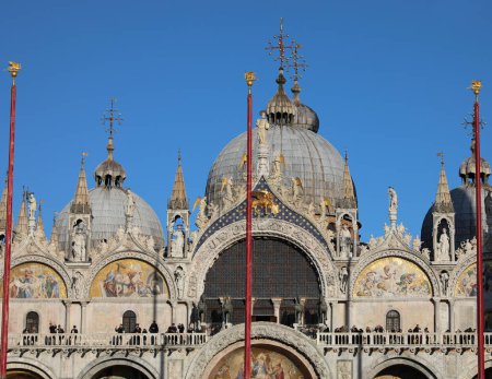 Photo for Venice, VE, Italy - February 13, 2024: Detail of facade of Saint Mark with statues and big Domes - Royalty Free Image