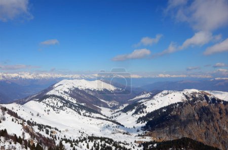 Breathtaking panorama of the European Alps mountain range in winter with snow-capped peaks without people