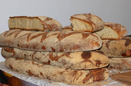 huge loaves of bread cooked on the wood-fired oven of the Italian bakery