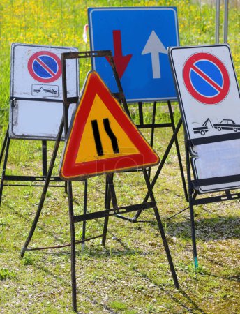 set of road signs indicating a narrowing without a single no-stopping sign suitable as a driving licence exam concept