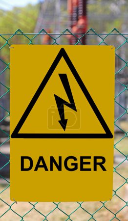 Danger high voltage risk of death sign  with lightning bolt in yellow triangle