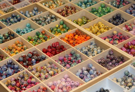 many colored beads ideal for adorning necklaces and personalizing them in the hobby shop