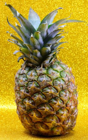 ripe pineapple fruit with highly detailed golden glitter background