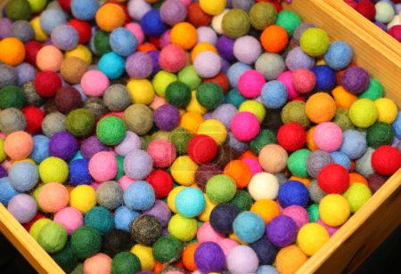 many colorful balls made of boiled wool on sale in the hobby and pastime shop