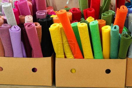 Numerous colorful rolls of felt material for sale in the hobby shop