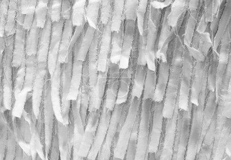 Téléchargez les photos : Fond abstrait fait avec des morceaux de tissu fileté blanc idéal comme fond pour le secteur de la couture - en image libre de droit