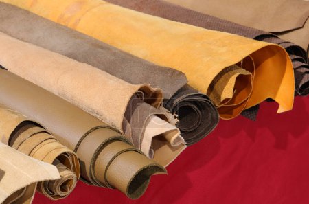 Photo for Rolls of leather for handcrafted clothing creations for sale in tailoring shop - Royalty Free Image
