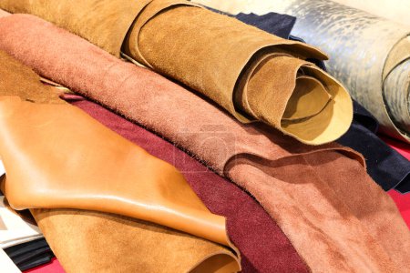 rolls of leather and tanned leather scraps for artisanal clothing creations for sale