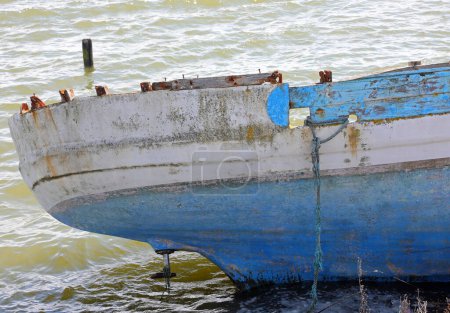 Wooden migrant boat shipwreck washed ashore after sea crossing