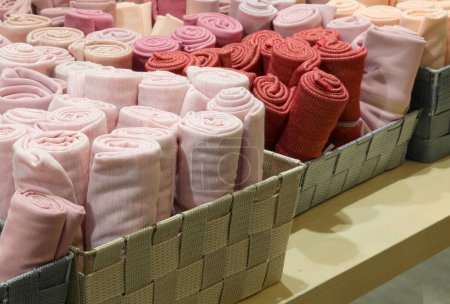 many colorful rolls of felt fabric for the creation of clothes and hobby objects on sale in the wholesale haberdashery shop
