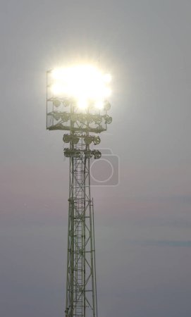 powerful floodlights from the lighting tower turned on during the event at the stadium