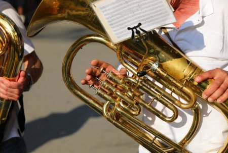 hand of Musician playing a brass instrument during a band parade