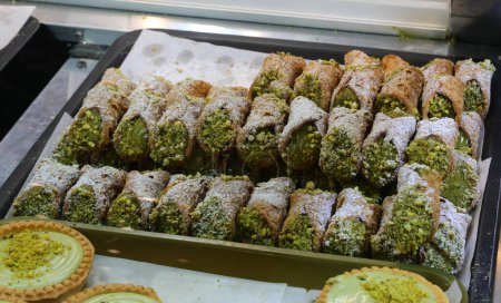 many Sicilian Cannoli Filled with Ricotta and pistachio