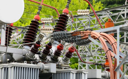intricate network of high-voltage cables and connectors intertwining with a colossal power transformer within the heart of a power plant