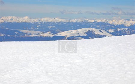 Snowy mountain panorama with snow in winter with clear blue sky and without people
