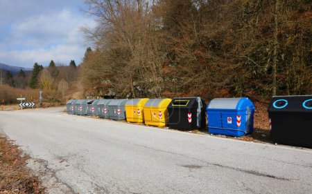 Row of recycling bins on the curbside in the country
