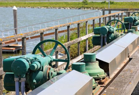 Big motorized sluice gates to regulate water flow in marshy areas and operate pumping stations