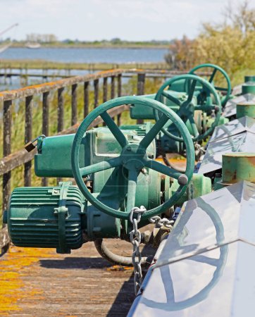 Big motorized sluice gates to regulate water flow in marshy areas and operate pumping stations