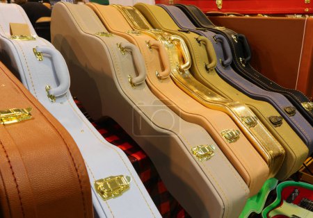 Photo for Hard case for protecting and transporting musical instruments like guitars basses and bows with gold locks - Royalty Free Image