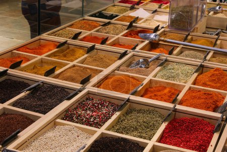 colorful assortments of flavorful spices, herbs, and peppercorns displayed at an international food stall