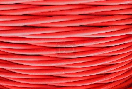 background of a tangled mess of high voltage red power cables