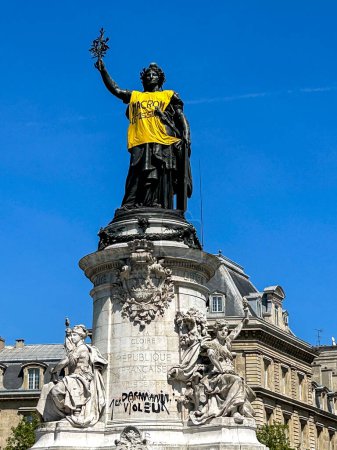Photo for Paris, France, Public Statue, of Liberty, with Anti-Macron Shirt, After Anti-Government, Anti-Macron, Anti-Retirement Law Reform Demonstrations, Place de la Republic - Royalty Free Image