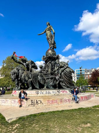 Photo for Paris, France, Public Statue, Graffitti Damage to CIty After Anti-Government, Anti-Macron, Anti-Retirement Law Reform Demonstrations, Place de la Nation - Royalty Free Image
