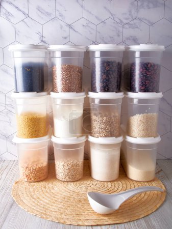 Organization of food storage in the kitchen, transparent reusable jars for cereals, coffee, sugar and pasta.