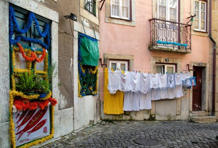 Photo for White clothes on a clothesline in Alfama the old town in Lisbon - Royalty Free Image