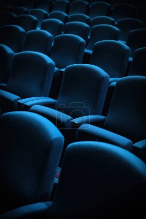 Close up of generic empty highlight  blue theater seats 