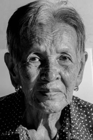 Lonely senior woman ,elderly,old woman,feelings,thoughtful,portrait sad depressed,wait, gloomy, worried, covering her face, Human face expressions ,(dementia and Alzheimers disease)