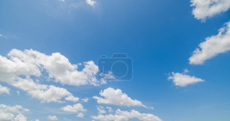 clear blue sky background,clouds with background, Blue sky background with tiny clouds. White fluffy clouds in the blue sky. Captivating stock photo featuring the mesmerizing beauty of the sky and clouds.