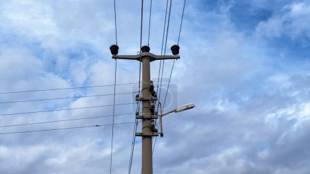 Photo for Dalaman, Turkey - Feb 18, 2024: A high power electrical cabling system on top of a utility pole - Royalty Free Image