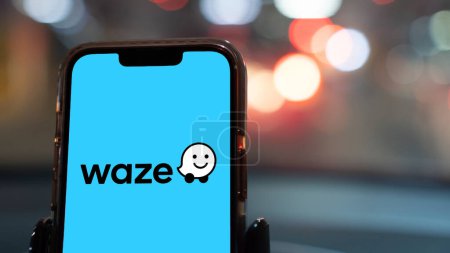 Photo for Istanbul, Turkey - February 20, 2024: Waze navigation app on a smartphone in a car. Waze is a navigation service for smartphones - Royalty Free Image