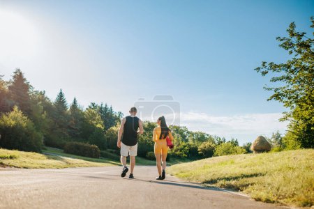 Photo for After Training Bond Back View of Two Athletes Standing Outdoors, Enjoying Each Others Company, Fitness Friends Two Athletes Enjoying Togetherness Outdoors - Royalty Free Image