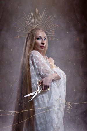 Photo for Goddess of fate moira with scissors is preparing to cut the thread of life. Ancient mythology - Royalty Free Image