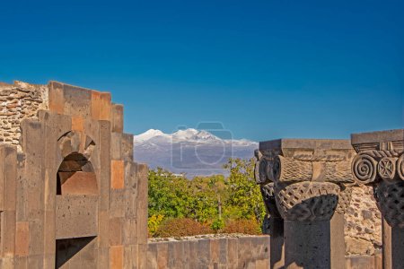 Ancient unique stone ruins of the Zvartnots temple, 640th years. AD, with Aragats Mountain on background, Armenia. Ancient architecture