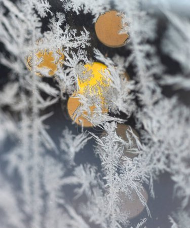 Photo for Ice crystals on glass, with blurred lights in background - Royalty Free Image