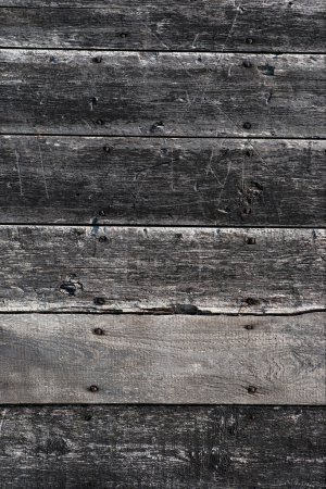 Photo for Worn weathered sratched wooden plank or wall in black and gray for background - Royalty Free Image