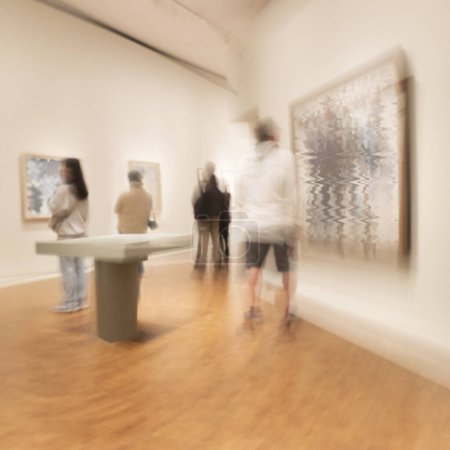 Photo for Art exhibition or museum with people in blurred motion studing the paintings - Royalty Free Image
