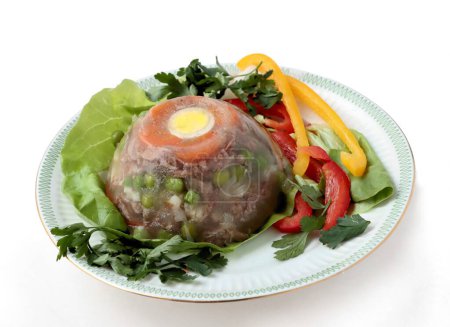 cooked veal meat as wholesome jelly with vegetables and eggs 