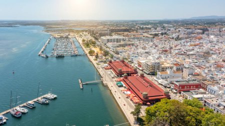 Photo for Aerial view of Portuguese fishing tourist town of Olhao with a view the Ria Formosa Marine Park. Sea port for yachts. High quality photo - Royalty Free Image