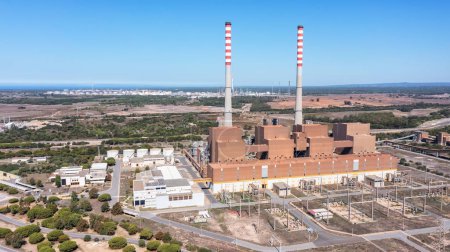Photo for Aerial view of a coal-fired power plant in the city of Sines, overlooking the sea in Portugal. High quality 4k footage - Royalty Free Image