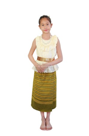 Photo for Beautiful Asian girl child in traditional Thai costume dress composed standing posture isolated on white background. Image full length with clipping path. - Royalty Free Image